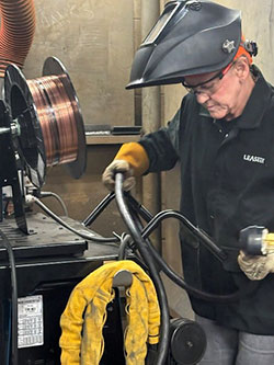 Barb Magee in welding lab