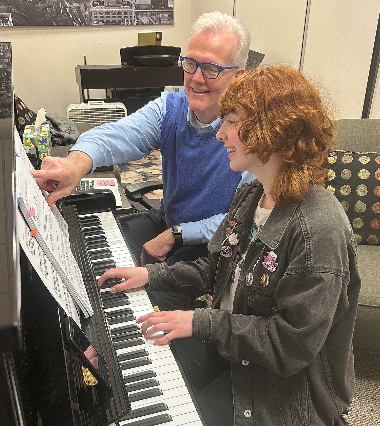 Two people at a piano