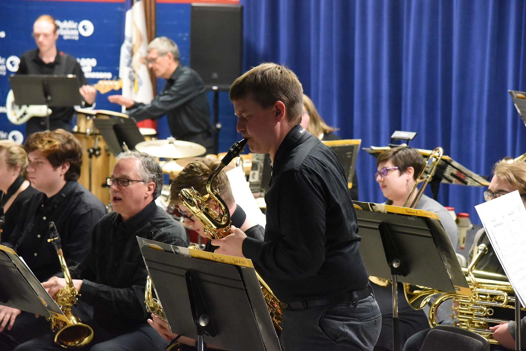 Close up of Saxaphone person playing a solo in the jazz band