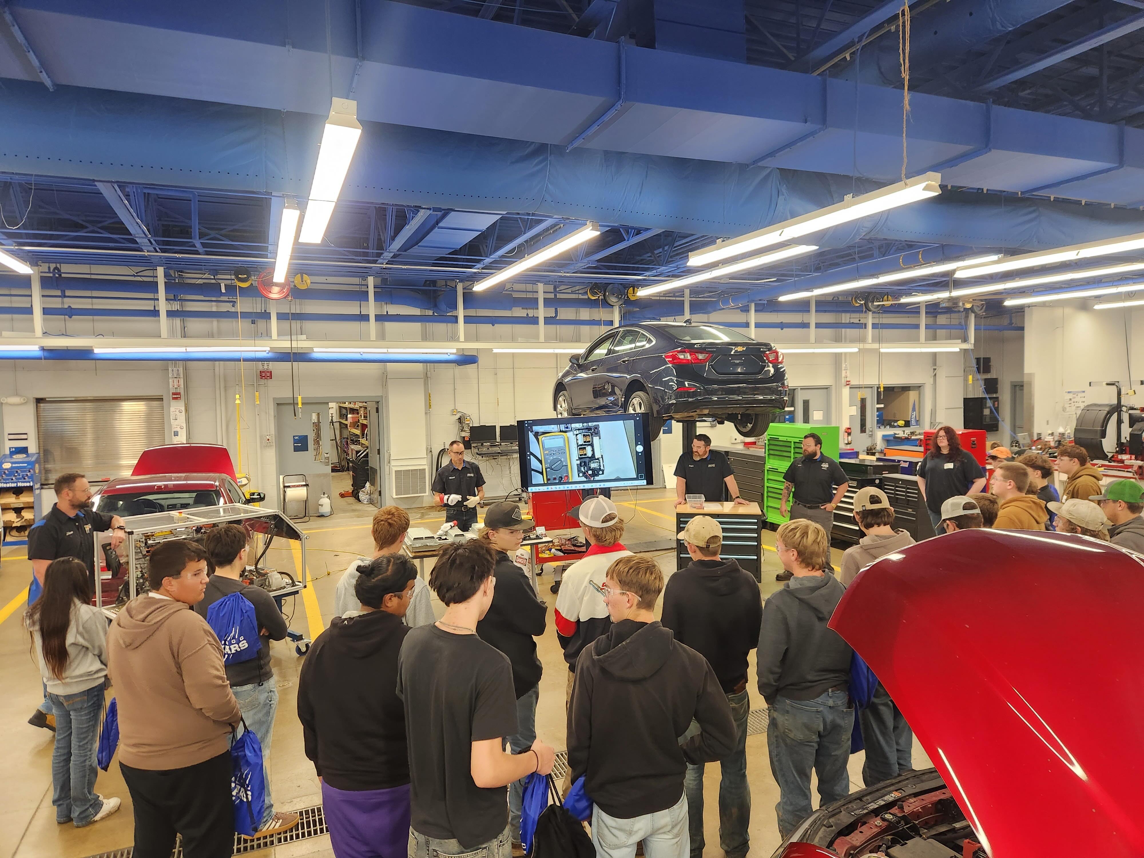 Attendees watch a Dodge Hellcat demonstration on DMACC's chassis dynamometer during the welcome session at Discover DMACC Auto/Diesel Day.