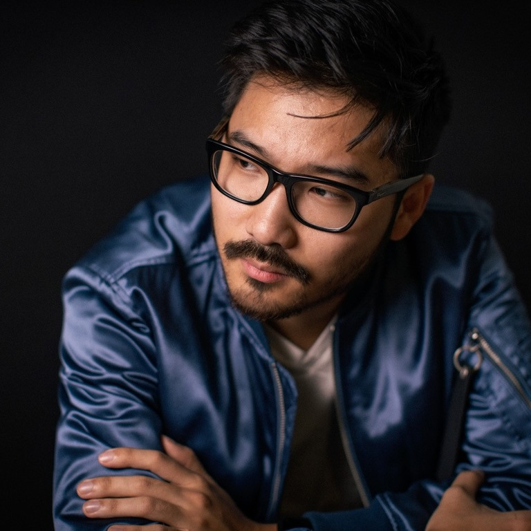 Headshot photo of novelist Tom Lin